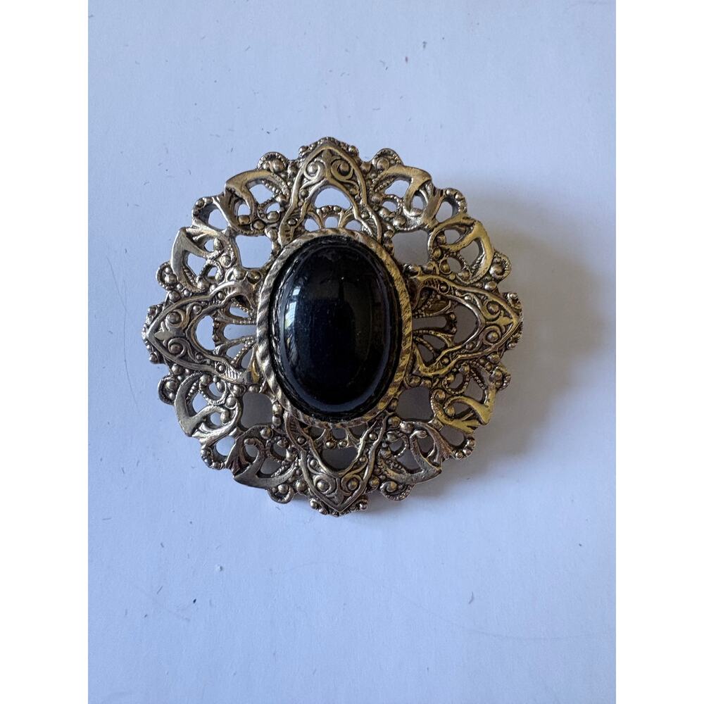 Vintage Gold-Tone Filigree Brooch with Black Center Stone